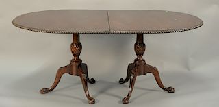 Chippendale style oval dining table with double pedestal claw feet, gardroone edge with two 24 inch leaves, and pads. ht. 30 in., to...