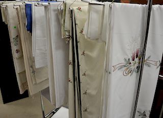 Group of assorted linen to include holiday tablecloths, napkins, embroidered tablecloths, etc.