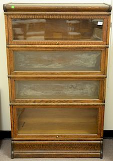 Oak four section stacking bookcase (two glass panels sick). ht. 56in., wd. 34in., dp. 11in.