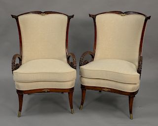 Pair of vintage mahogany fan back chairs with open carved arms.
