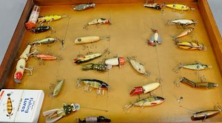 Twenty-seven various vintage fishing plugs in display case. lg. 3 in. to 7 in.