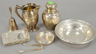 Sterling silver lot including creamer, covered jar, six small trays, bell, and dish. 23.8 t oz.