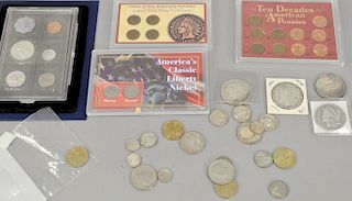 Coin collection including 1963 mint proof set, 4 Indian head pennies, nickel, 3 silver quarters, 2 half dollars, and 4 silver dollars.