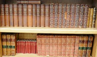 Large group of leatherbound books on seven book shelves to include Washington Irving's Works, Jewish History, World's Best Music, St...