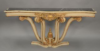 Continental style gilt decorated pier table with black marble top (professionally repaired). ht. 37 in., lg. 80 in., dp. 17 1/2 in.