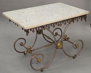 Iron brass trimmed table with marble top (slight tilt). ht. 29 in., top: 29" x 41"
