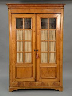 Continental style two door cabinet. ht. 84 in., wd. 56 in.