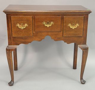 Mahogany lowboy with three drawers. ht. 33 in., wd. 34 in.