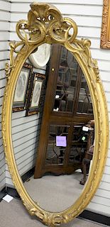 Victorian oval mirror, original gilt decoration. 71" x 36"