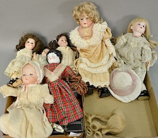 Group of seven dolls to include six bisque head dolls, one of a baby, and a porcelain doll (as is). total ht. 9in. to 13in.