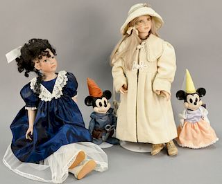 Four dolls including Dottie Dunsmore, Mickey & Minnie Mouse, and porcelain head doll. ht. 14 in. to 28 in.
