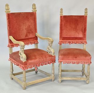 Set of six oak Continental style chairs including four side chairs and two armchairs with carved putti arms. armchairs: ht. 51in., s...