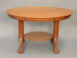 Mahogany ball and claw foot oval table with slide through drawer. ht. 30 in., wd. 50 in.