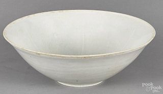Chinese carved pale celadon bowl with fish decoration, 2 3/8'' h., 7'' dia.