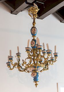 A FRENCH SEVRES-STYLE TURQUOISE-GROUND PORCELAIN AND ORMOLU MOUNTED TWELVE-LIGHT CHANDELIER, CIRCA 1900