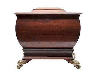 Regency Mahogany Cellarette, with brass paw feet and casters and loose ring lion head handles, 19th century