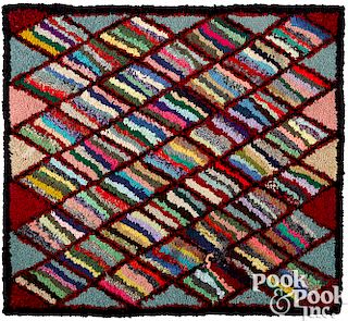 Two variegated hooked rugs
