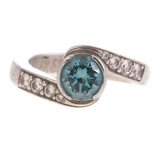 A Lady's Platinum Blue Diamond Bypass Ring