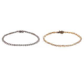 A Pair of Lady's Diamond Line Bracelets in Gold