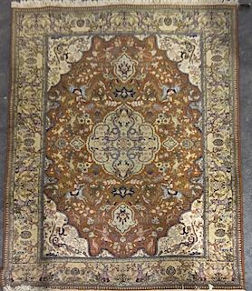 * A Persian Wool Rug, 9 feet 3 inches x 6 feet 9 inches.