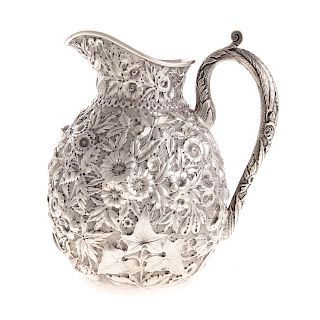 Kirk repousse coin silver pitcher