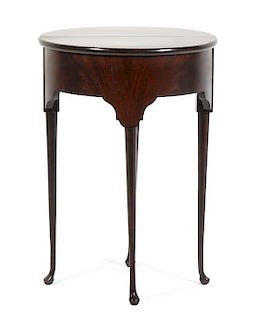 A Demilune Flip-Top Table, Height 26 7/8 x diameter 19 1/8 inches.