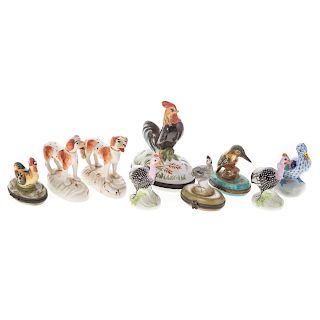 Nine assorted animal figurines and boxes