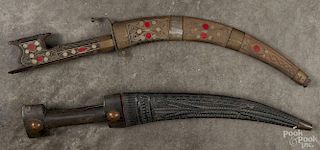 Two Middle Eastern curved blade daggers, late 19th c., 15'' l. and 15 1/2'' l.