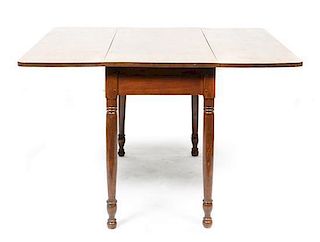 A Birch Drop-Leaf Table, Height 28 1/4 x width 42 x depth 46 inches.