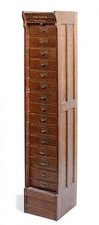 A Tambour-Front Oak Filing Cabinet, Height 74 1/8 x width 13 7/8 x depth 17 1/8 inches.