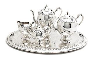 A Mexican Silver Four-Piece Tea Set and Tray, Length over handles of tray 20 inches.