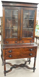 Two part inlaid cabinet with glass doors over two drawers on two drawer base with X stretcher. ht. 77in., wd. 37in.