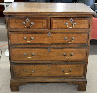 Two over three drawer oak chest on bracket feet. ht. 42in., wd. 39in.