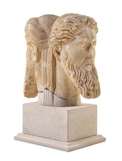 * A Roman Marble Janiform Herm Head Height 13 1/2 inches.