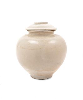 * A Glazed White Ware Jar and Cover Height 8 1/2 inches.