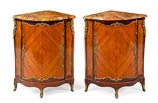 A Pair of Louis XV Gilt Bronze Mounted Palissandre and Tulipwood Encoignures Height 37 x width 28 1/2 x depth 20 inches.