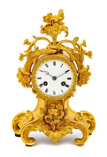 A Louis XV Style Gilt Bronze Mantel Clock Height 10 1/4 inches.
