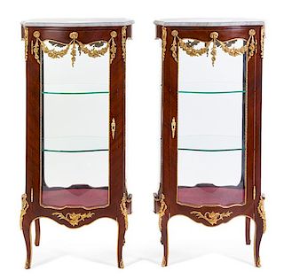 A Pair of Louis XV Style Gilt Metal Mounted Vitrines Height 50 3/4 x width 24 1/2 x depth 17 1/2 inches.