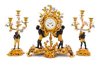 A Louis XV Style Gilt Bronze and Porcelain Mounted Clock Garniture Height of mantel clock 19 1/2 inches.