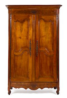 A French Provincial Walnut Armoire Height 90 1/2 x width 52 1/4 x depth 21 inches.