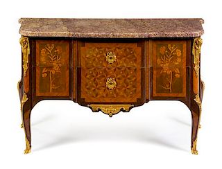 A Transitional Style Gilt Bronze Mounted Marquetry and Parquetry Commode Height 34 x width 57 1/4 x depth 23 1/2 inches.