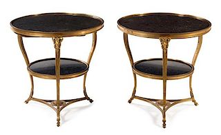 A Pair of Neoclassical Gilt Bronze Gueridons Height 27 1/2 x diameter of top 28 inches.