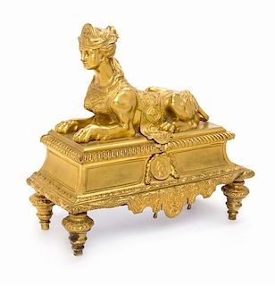 A Louis XVI Style Gilt Bronze Chenet Height 14 x width 14 3/8 inches.