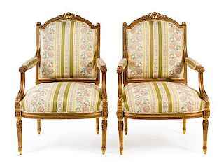 A Pair of Louis XVI Style Giltwood Fauteuils Height 41 inches.