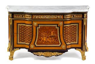 A Louis XVI Style Gilt Bronze Marquetry and Parquetry Commode Height 38 1/2 x width 69 1/2 x depth 26 1/2 inches.