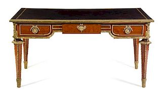 A Louis XVI Style Gilt Bronze Mounted Bureau Plat Height 30 1/4 x width 59 1/2 x depth 31 1/2 inches.