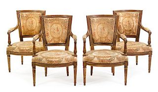 A Set of Four Louis XVI Giltwood Fauteuils Height 34 inches.