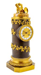 An Empire Gilt and Patinated Bronze Tower Clock Height 16 1/4 inches.