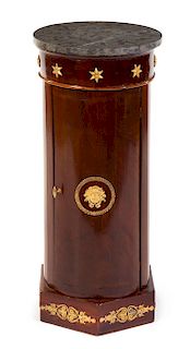 An Empire Style Gilt Bronze Mounted Mahogany Pedestal Cabinet Height 32 3/4 x diameter of top 14 1/2 inches.