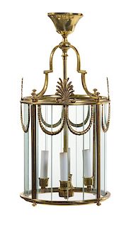 An Empire Style Gilt Metal Four-Light Hall Lantern Height 22 x diameter 10 1/2 inches.